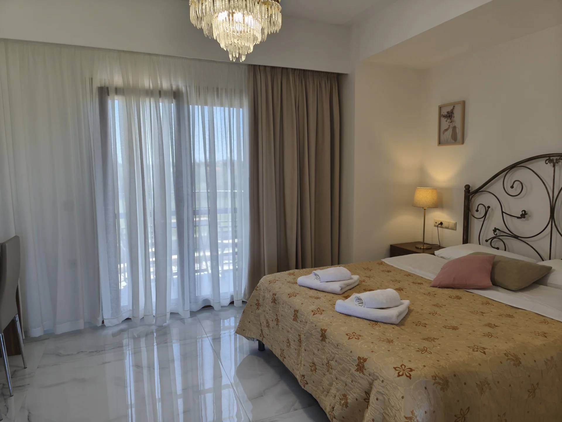 Superior Double Sea View room with king-size bed and large terrace doors