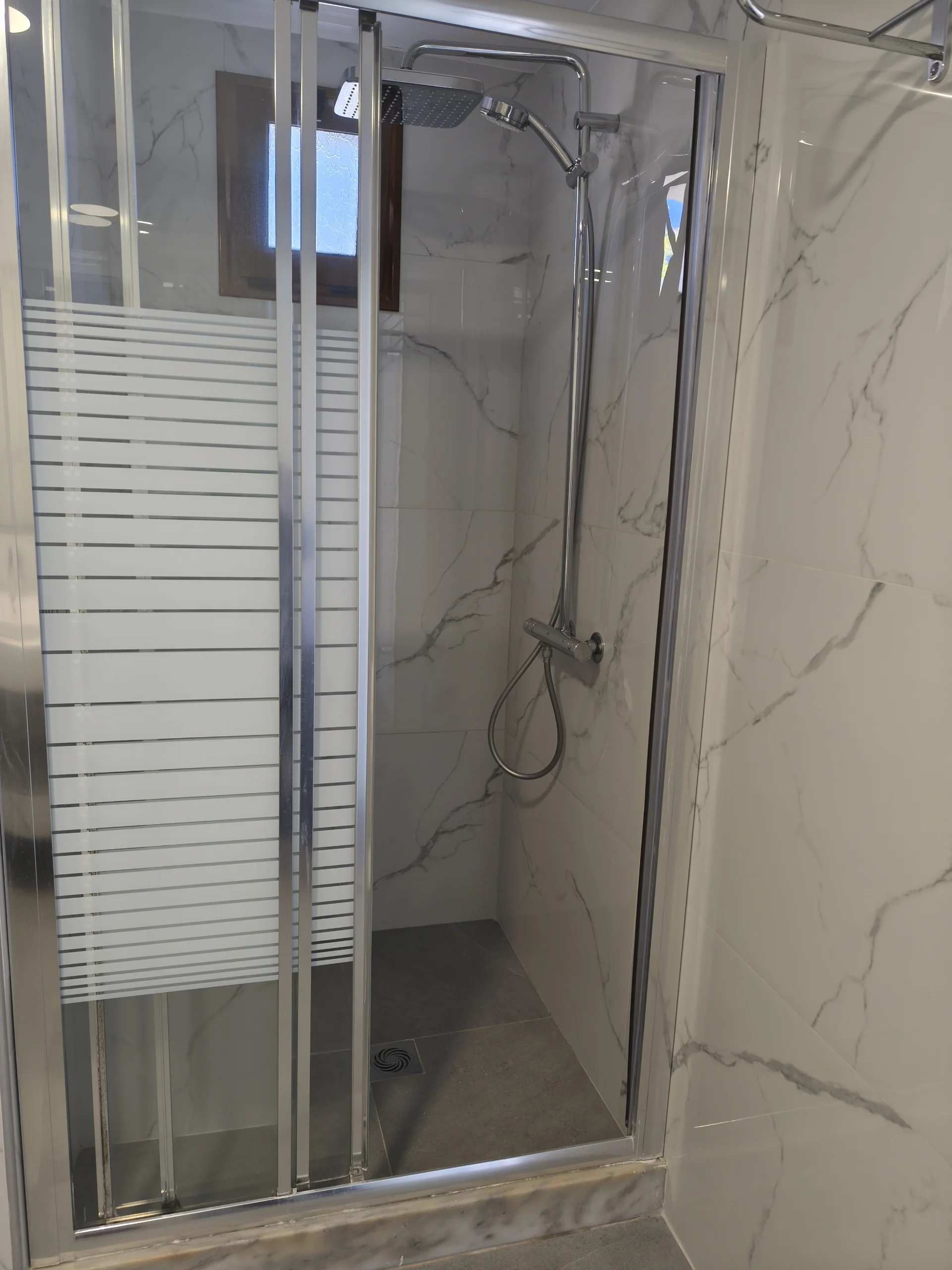 Premium bathroom with walk-in shower in the Superior Double Sea View room